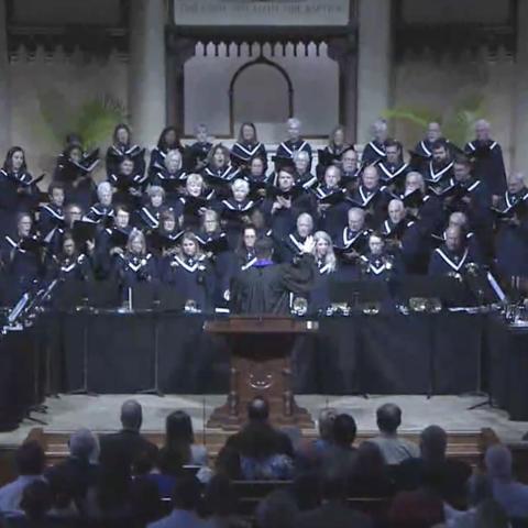 sanctuary choir and adult handbells singing and ringing in worship
